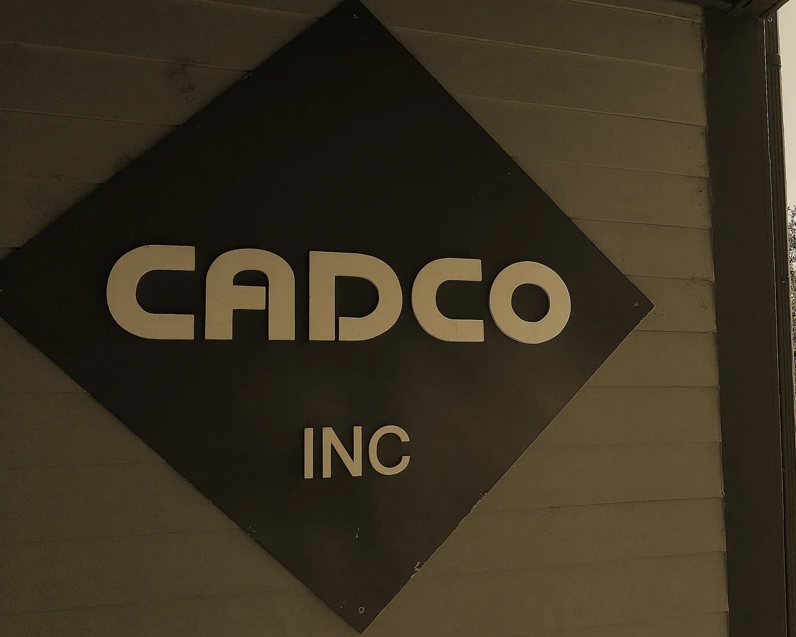 The CADCO diamond sign on our office in Erie